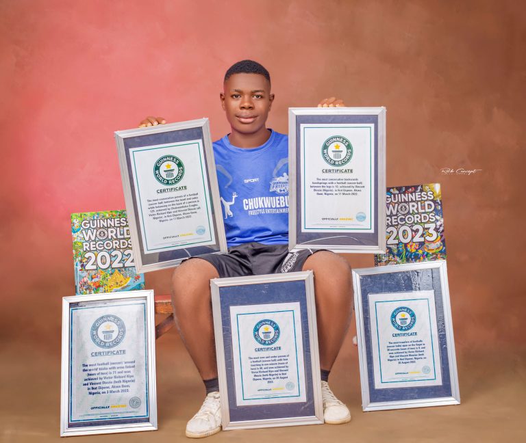 Mr-Okezie-showcasing-his-GWR-certificates-scaled